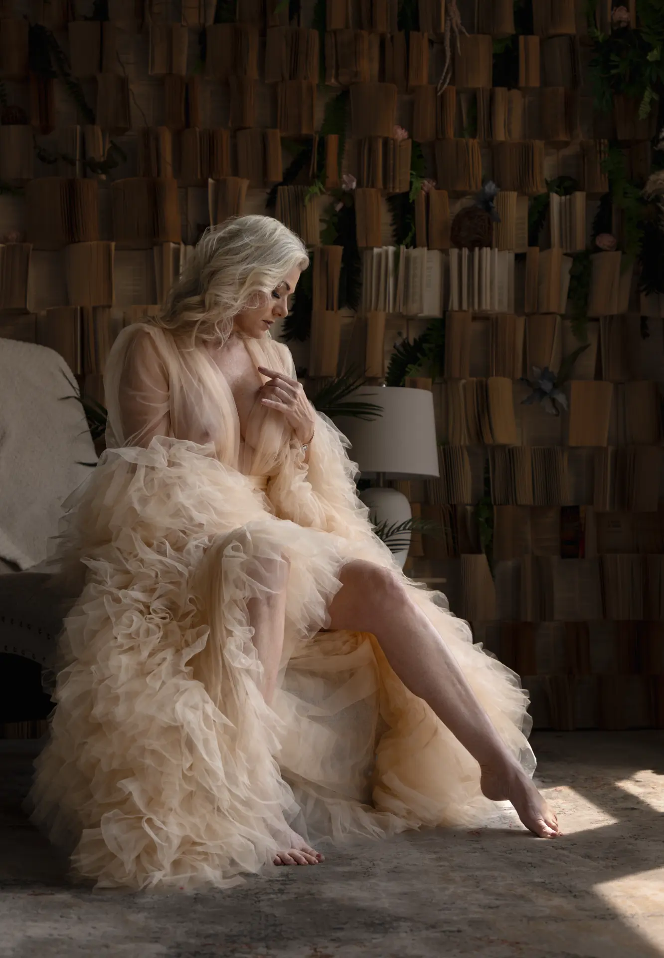 Woman in silk robe by window